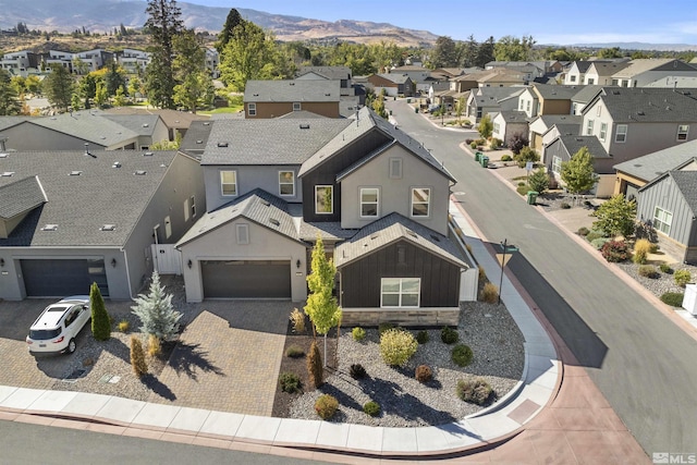birds eye view of property featuring a mountain view and a residential view