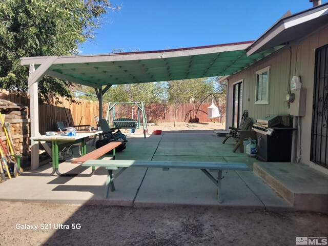 view of patio featuring a grill