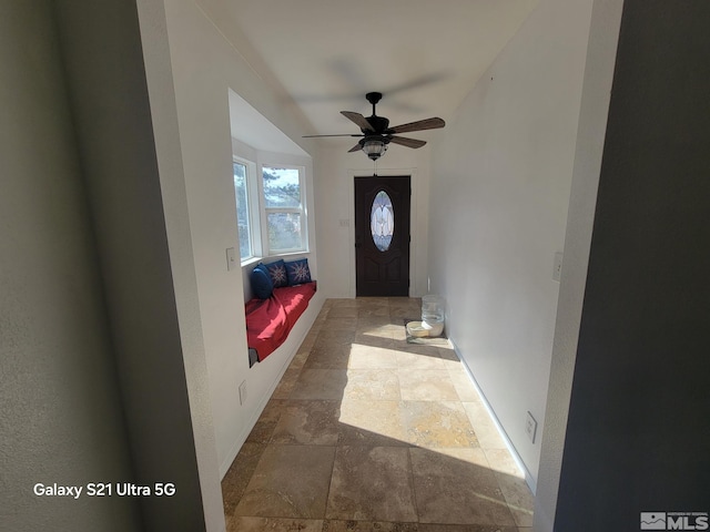 interior space featuring ceiling fan