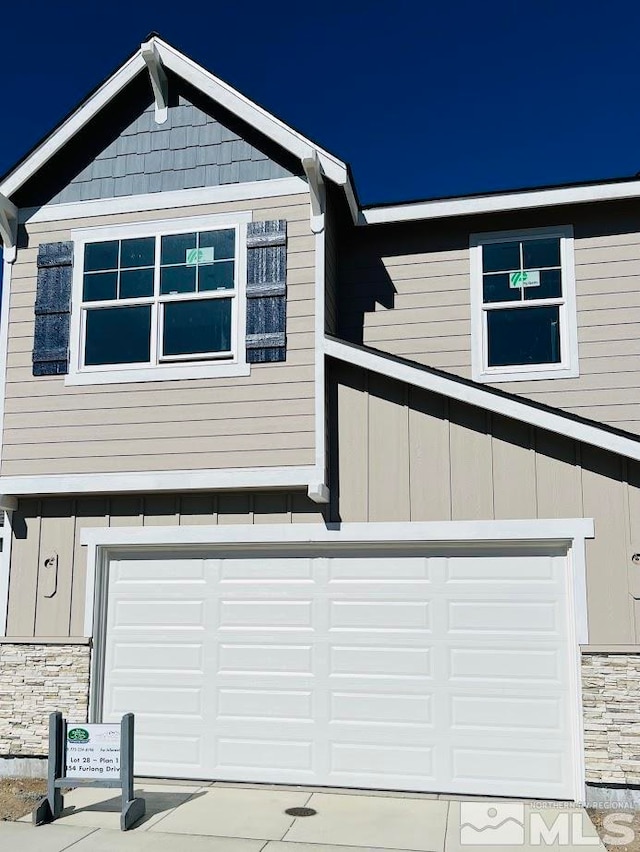 view of side of home featuring a garage