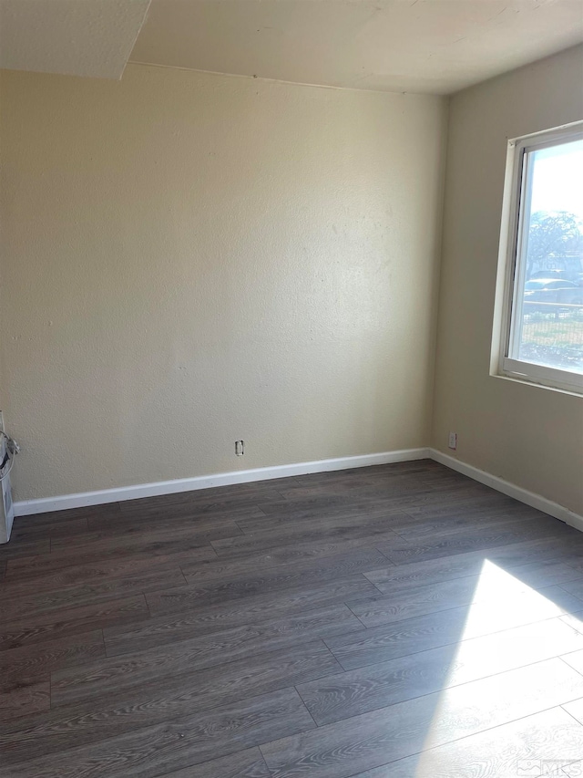 empty room featuring dark hardwood / wood-style floors