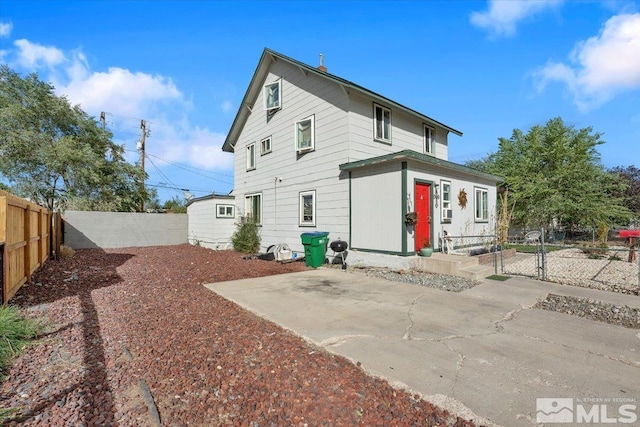 rear view of house with a patio area