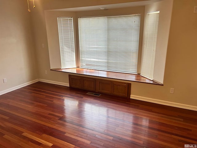 empty room featuring dark hardwood / wood-style floors