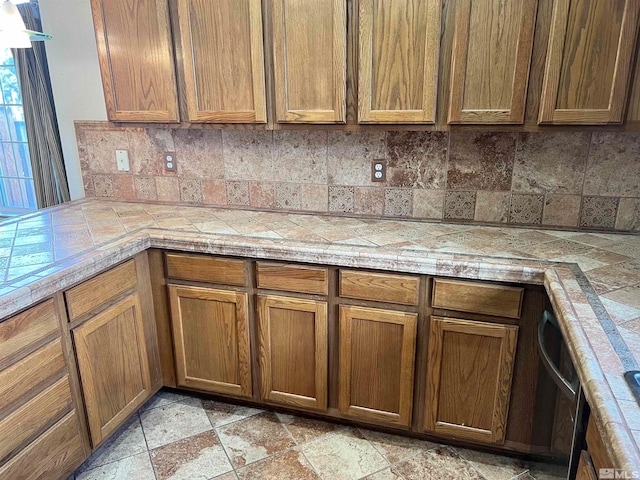 kitchen with tile countertops and backsplash