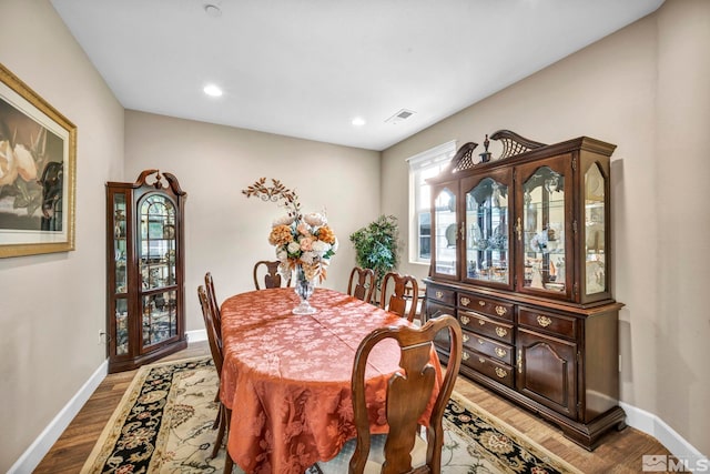 dining room with wood-type flooring