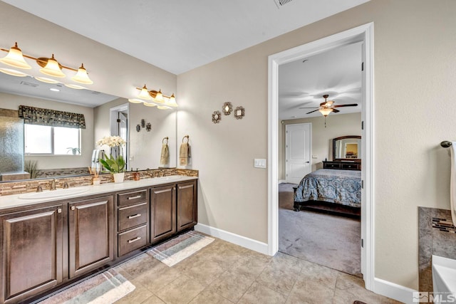 bathroom featuring ceiling fan, vanity, and tile patterned flooring