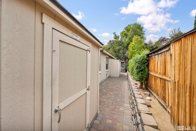 view of property exterior featuring a patio area