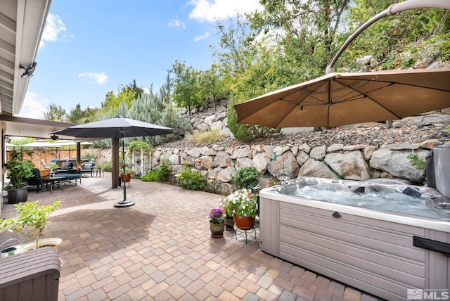 view of patio featuring a hot tub