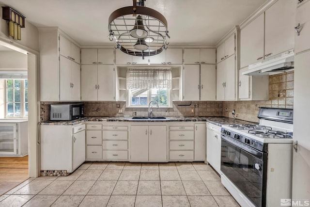 kitchen with white cabinetry, white gas range, and plenty of natural light