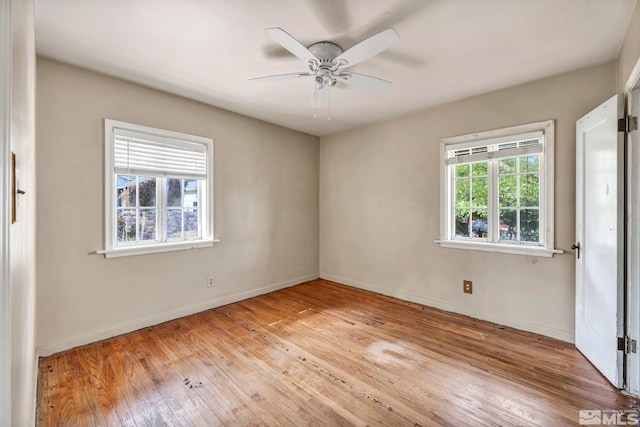 empty room featuring light wood-type flooring and ceiling fan