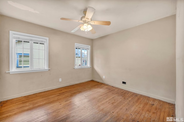 empty room featuring ceiling fan and light wood-type flooring