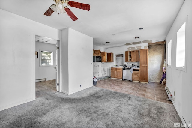 unfurnished living room featuring ceiling fan, light colored carpet, and a baseboard heating unit