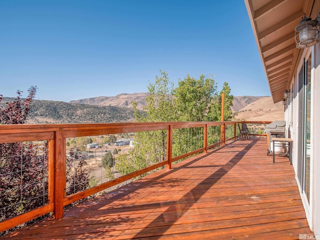 wooden terrace featuring a mountain view