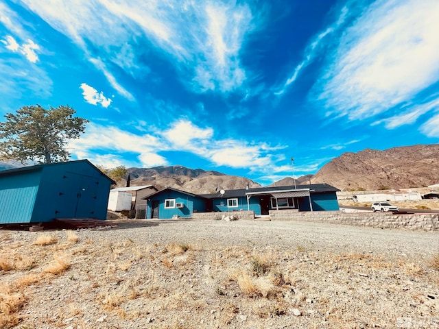 back of house featuring a mountain view