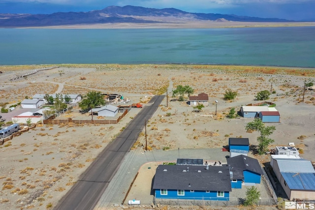 bird's eye view with a water and mountain view