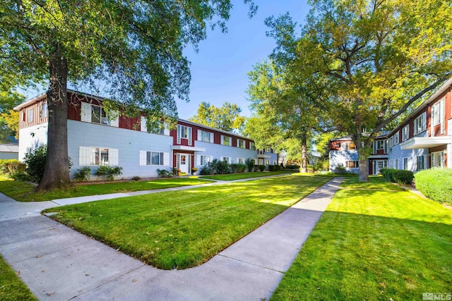 surrounding community featuring a lawn