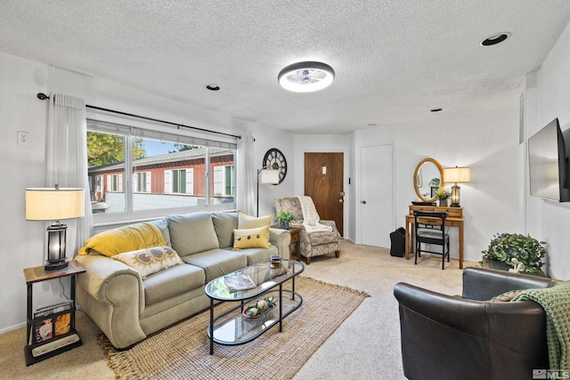 living room with light carpet and a textured ceiling