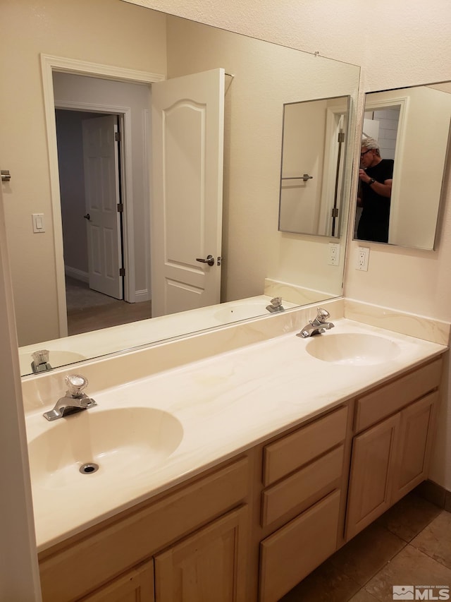 bathroom featuring vanity and tile patterned flooring