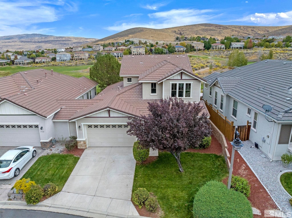 view of front of house featuring a garage and a mountain view