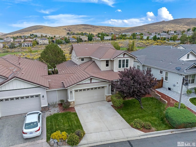 view of front of house featuring a mountain view and a garage