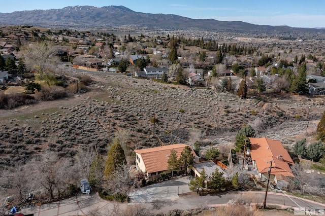 drone / aerial view featuring a mountain view