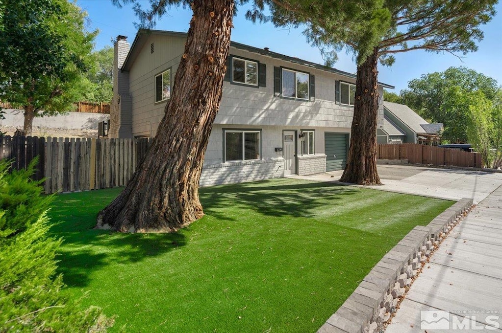 back of property featuring a yard and a patio area