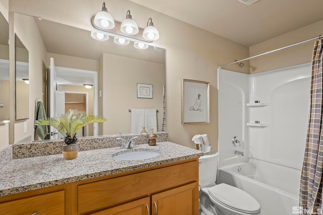 full bathroom featuring vanity, shower / tub combo, and toilet