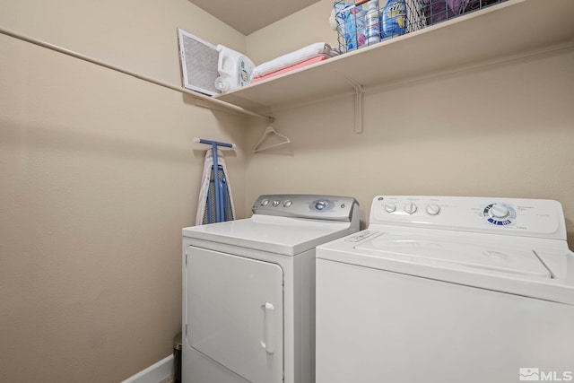 washroom with independent washer and dryer