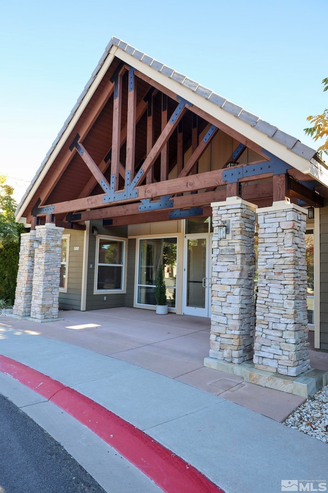 entrance to property with a patio area