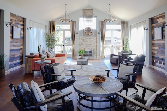 interior space with hardwood / wood-style flooring, a fireplace, and lofted ceiling