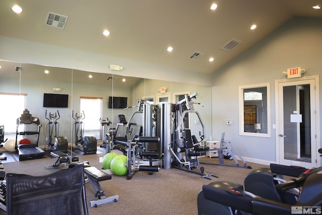 workout area with high vaulted ceiling