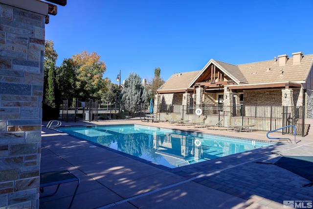 view of swimming pool featuring a patio