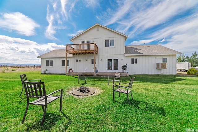 rear view of property featuring a lawn