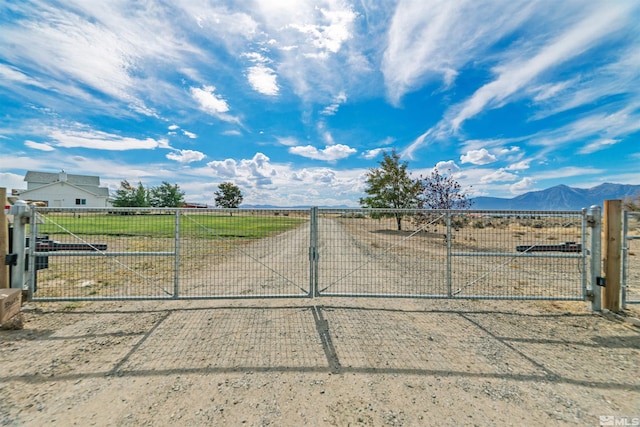 view of gate with a mountain view