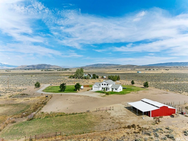 bird's eye view featuring a mountain view and a rural view