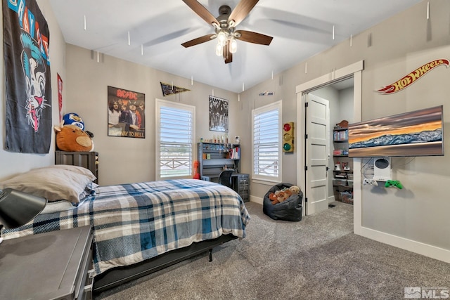 bedroom with ceiling fan and carpet flooring