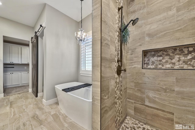 bathroom with an inviting chandelier, vanity, and independent shower and bath