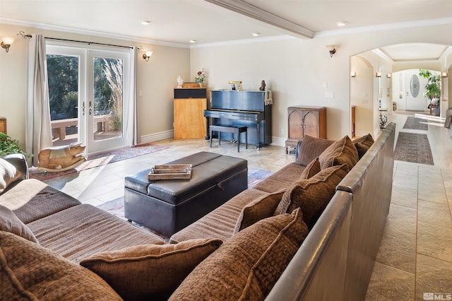 living room featuring ornamental molding, beamed ceiling, and french doors