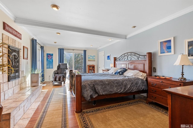 bedroom with light hardwood / wood-style flooring and crown molding