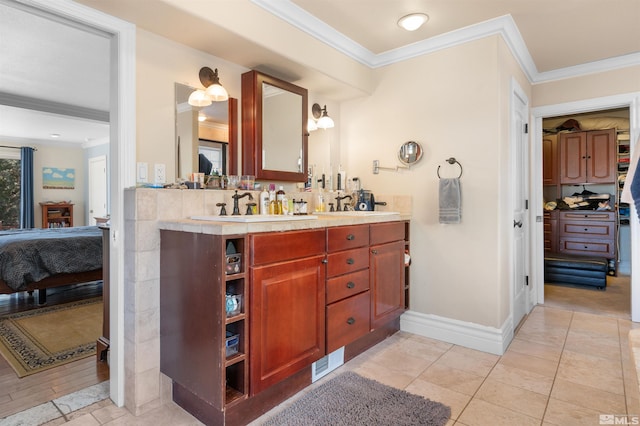 bathroom featuring vanity and ornamental molding