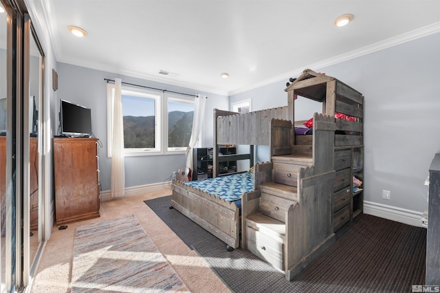 carpeted bedroom featuring ornamental molding