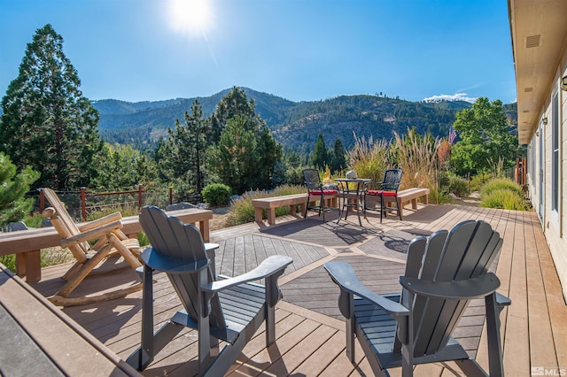 wooden deck with a mountain view