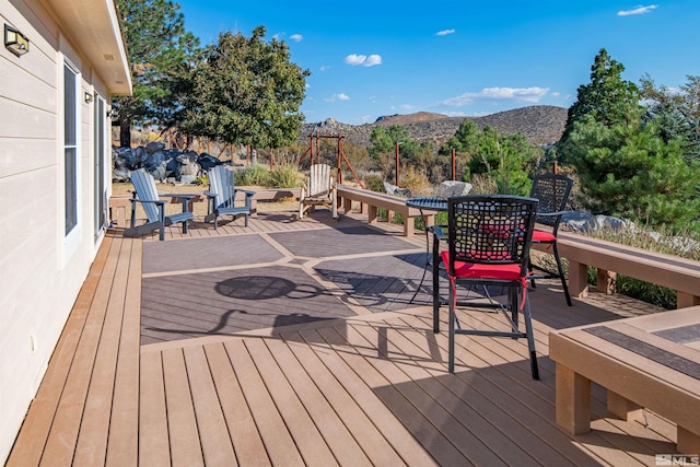 wooden terrace featuring a mountain view