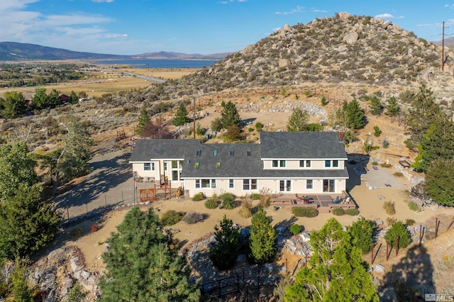 birds eye view of property featuring a mountain view