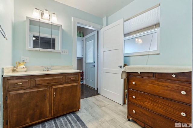 bathroom featuring vanity and hardwood / wood-style flooring