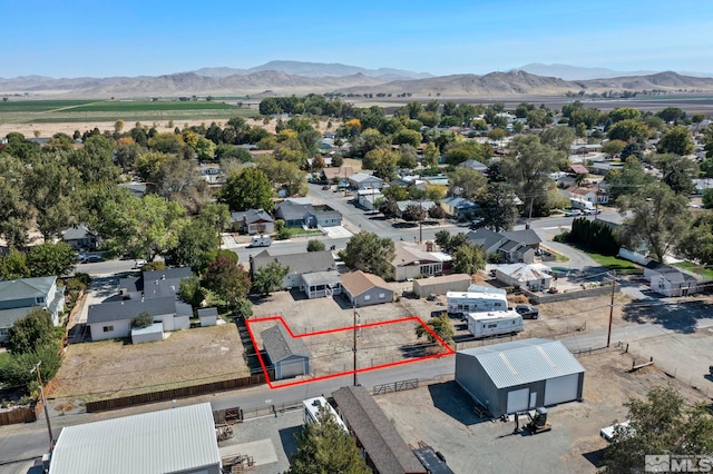 birds eye view of property featuring a mountain view