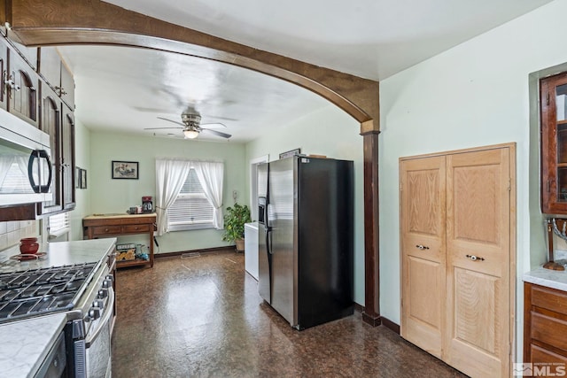 kitchen featuring appliances with stainless steel finishes and ceiling fan