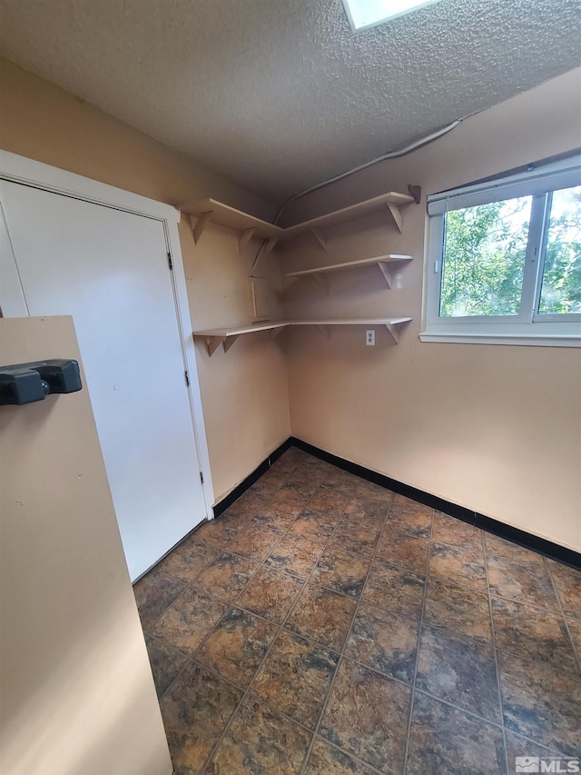 basement with a textured ceiling