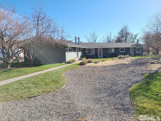 ranch-style house with a front yard