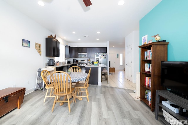 dining room featuring ceiling fan and light hardwood / wood-style flooring